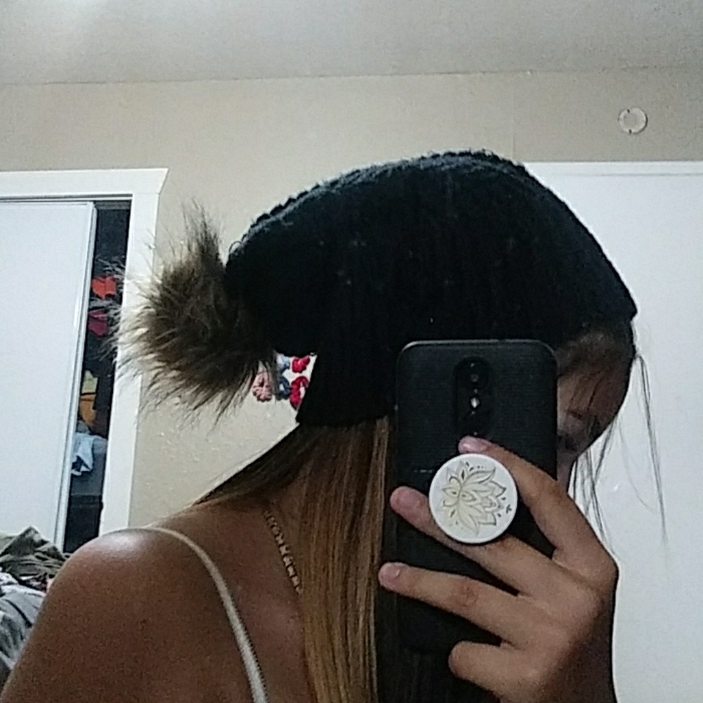 Black beanie with brown puffball